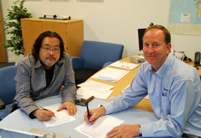 Masayuke Uchiyama signs the distributor agreement with Harry Thuillier, Commercial Director at Racelogic.